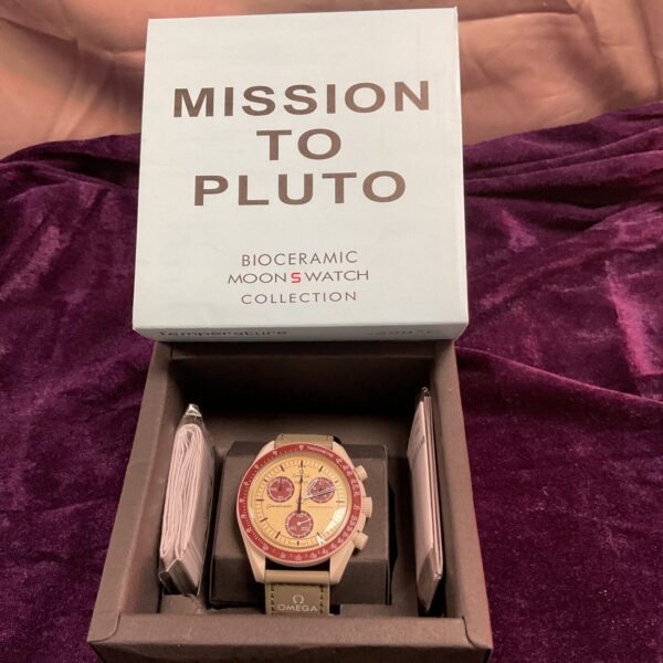 White Omega Swatch Biometric Moon Watch “Mission to Pluto” in box.