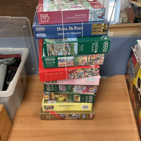 Assorted jigsaw puzzles lot including Falcon Deluxe and Gibsons brands.