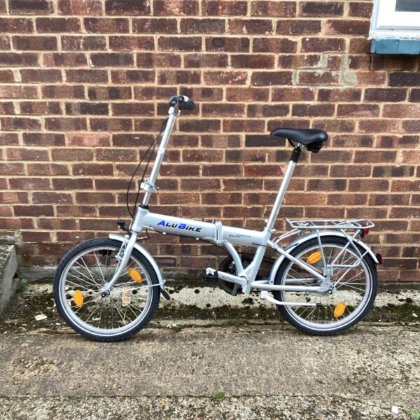 Silver Alu Bike City folding bicycle with rack and mudguards.