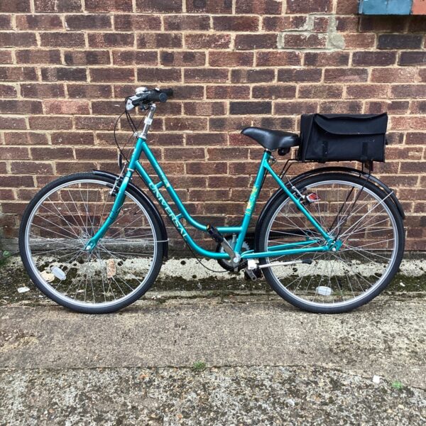 Side view of a vintage Universal La Riviera bicycle with pannier rack.