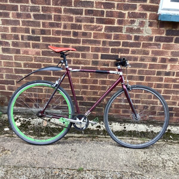 Stylish Plug Charge fixed gear bike for urban commuting.