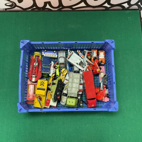Crate of vintage diecast model cars and vehicles.