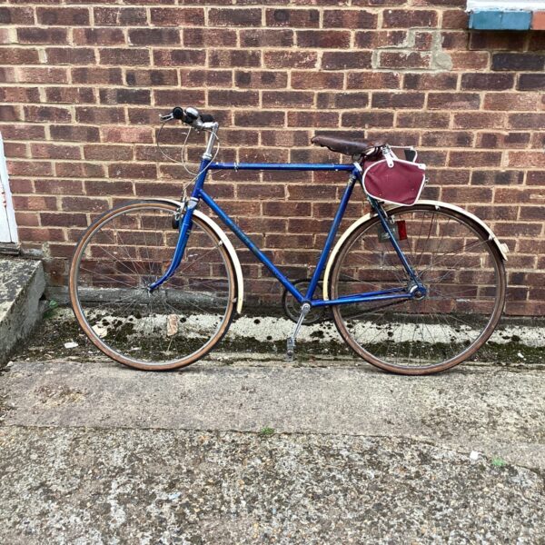 Side view of a vintage Rudge bicycle in blue.