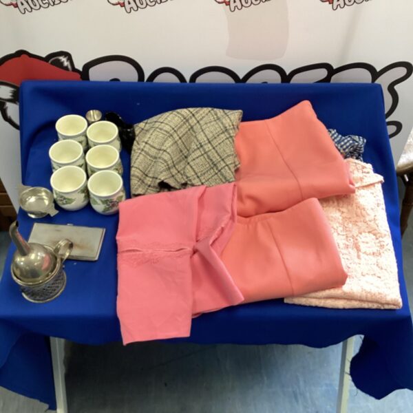 Mixed lot of vintage ladies skirts and collectibles.