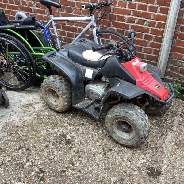 Side view of a used Kazume Childs Quad Bike for sale.