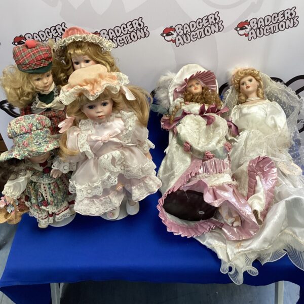 A lot of vintage porcelain dolls on display.