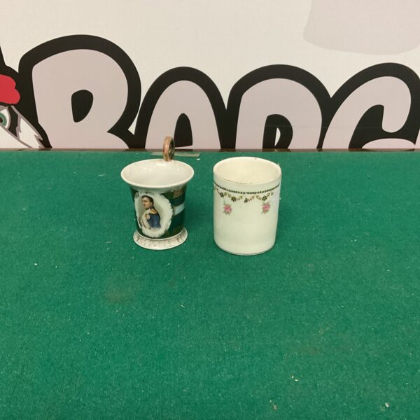 Antique porcelain coffee cup with Napoleon portrait, collectible item.
