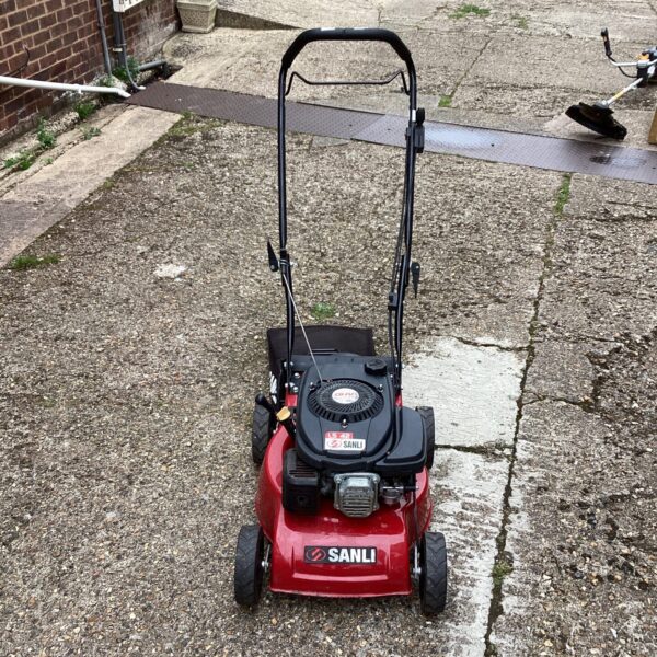 Sanli LS 42 lawn mower in a garden setting.