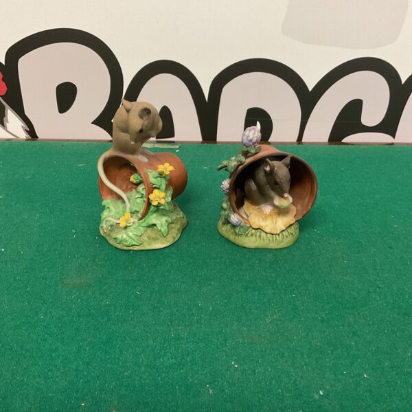 Detailed Alfretto porcelain mouse peeking from a flower.
