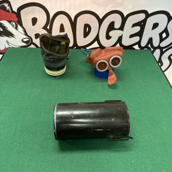 Pair of vintage WWII children’s gas masks, one with perished rubber.