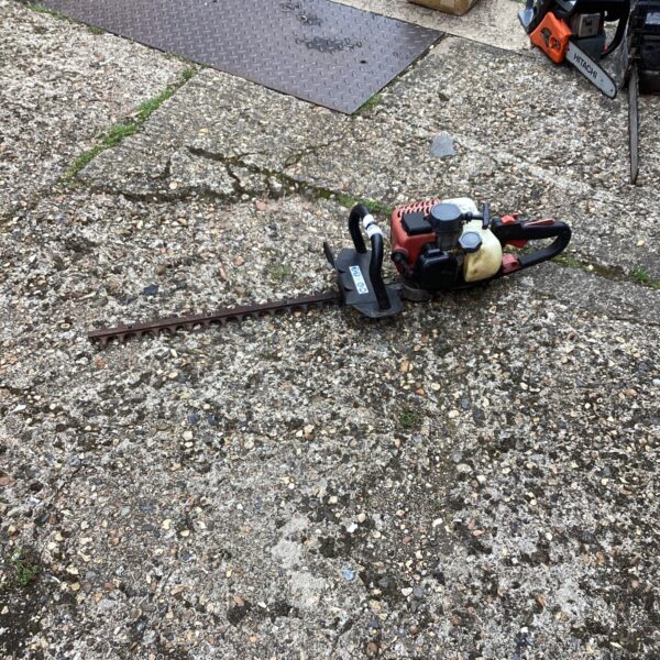 Used petrol hedge trimmer for garden maintenance and landscaping.