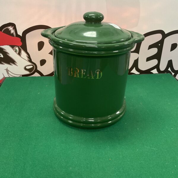 Vintage green ceramic bread bin for kitchen storage.