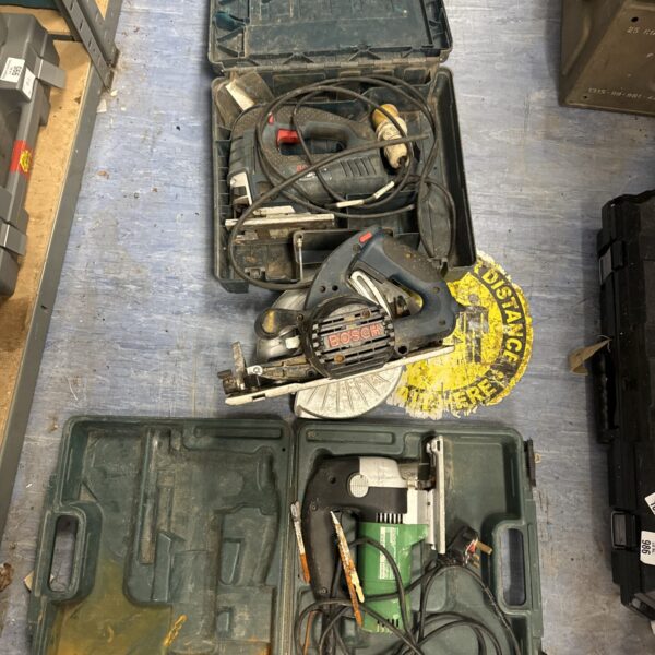 Vintage power tool lot with carrying case, including a jigsaw and circular saw.