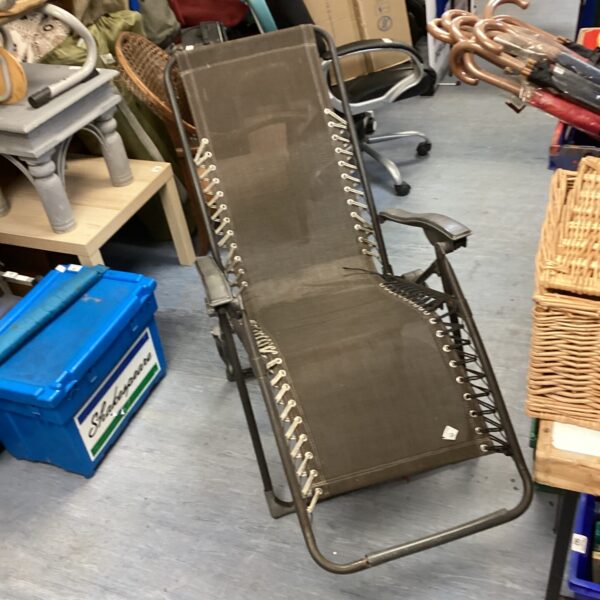 Folding garden sun lounger with metal frame.