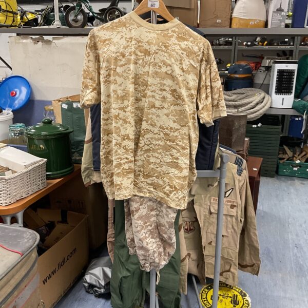 Front view of UAE Airforce camo uniform on a rolling stand.