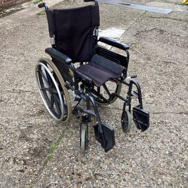Silver folding wheelchair with black seat, a mobility aid.