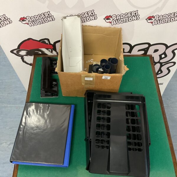 Mixed lot of office supplies including binders and hole punch.