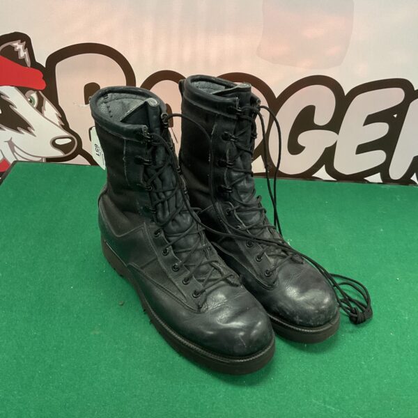 Black leather American flying boots, size 8, displayed on green background.