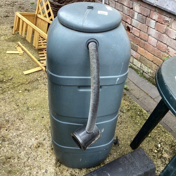 Grey plastic garden water butt with base for rainwater collection.