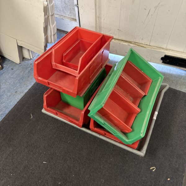 Red and green RS racking trays, a quantity of workshop storage bins.