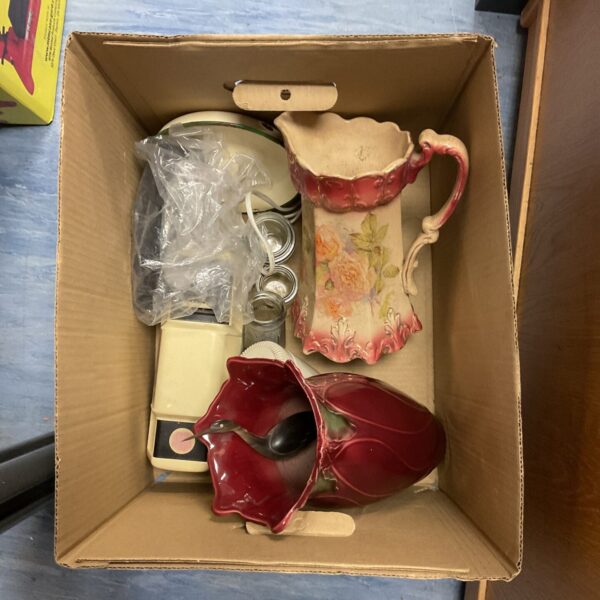 Antique porcelain vase collection with floral design and vintage items.