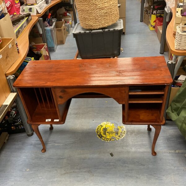 Antique mahogany kneehole desk with storage cupboards.
