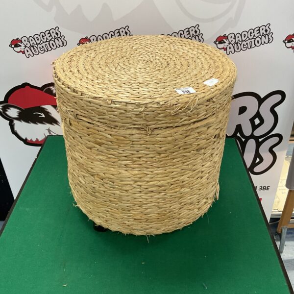 Round rattan laundry basket for home storage and organisation.