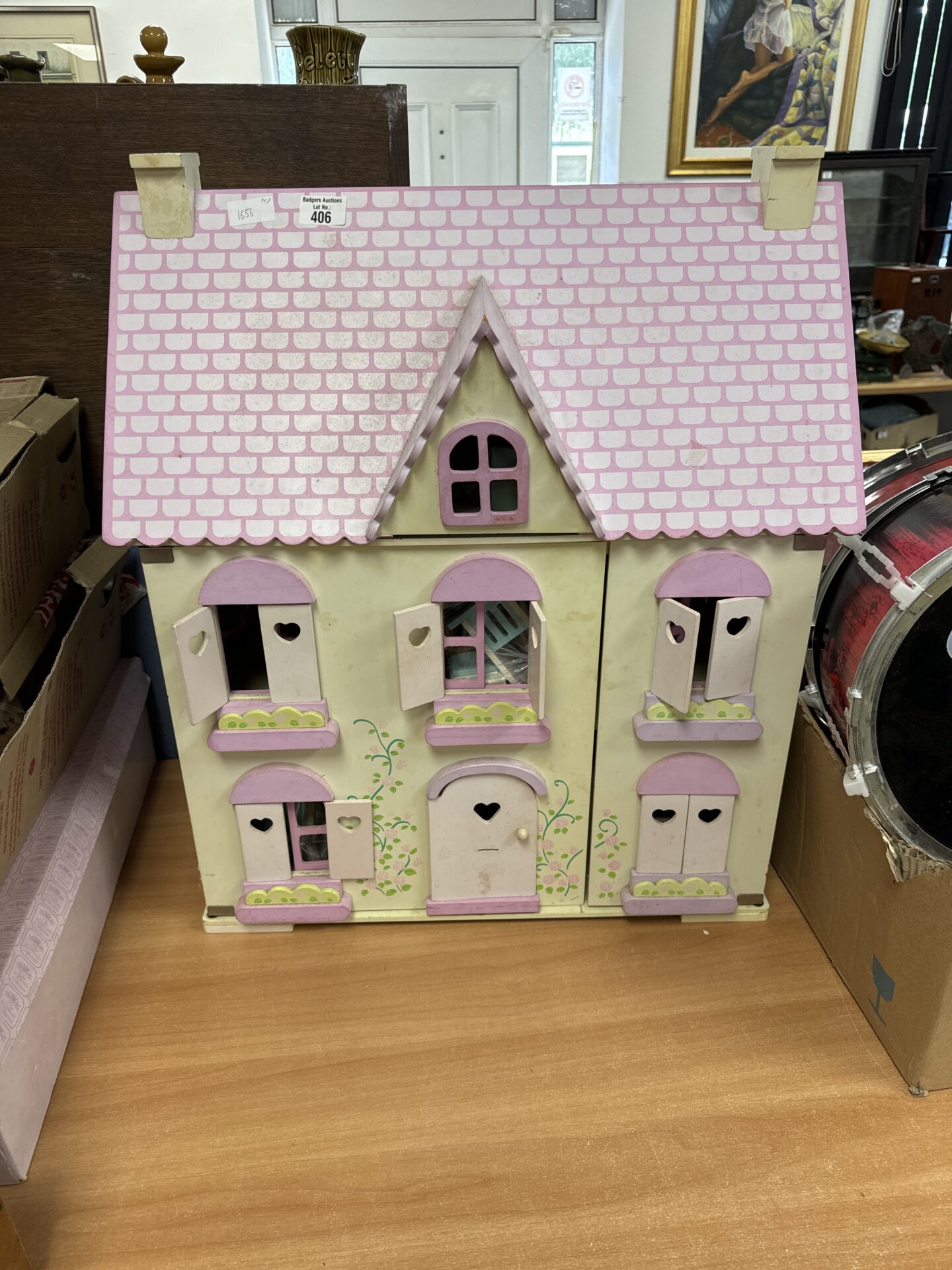 406 Children’s dolls house with contents 27.5” tall x 23.75” width x 13” depth at furthest points