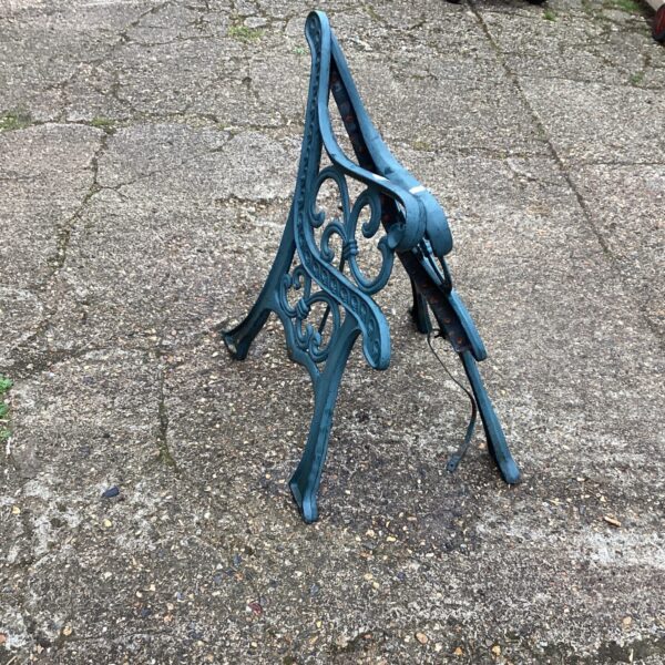 Pair of antique wrought iron garden bench ends with Victorian detailing.