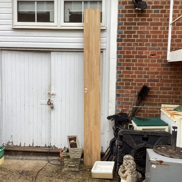 Long solid wood kitchen worktop in used condition, ideal for DIY projects.