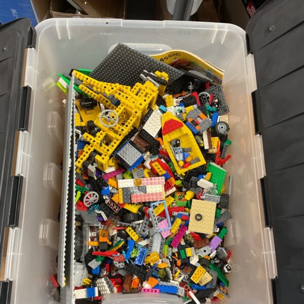 Large lot of assorted Lego pieces for building and creative play.