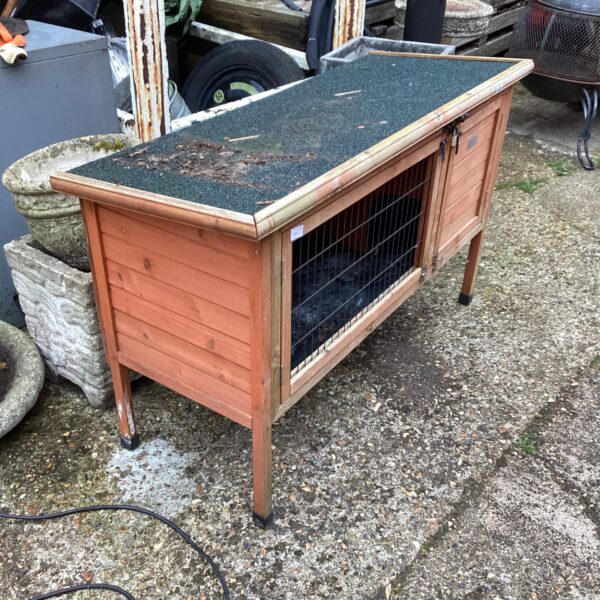 Wooden small animal hutch for rabbits and guinea pigs.
