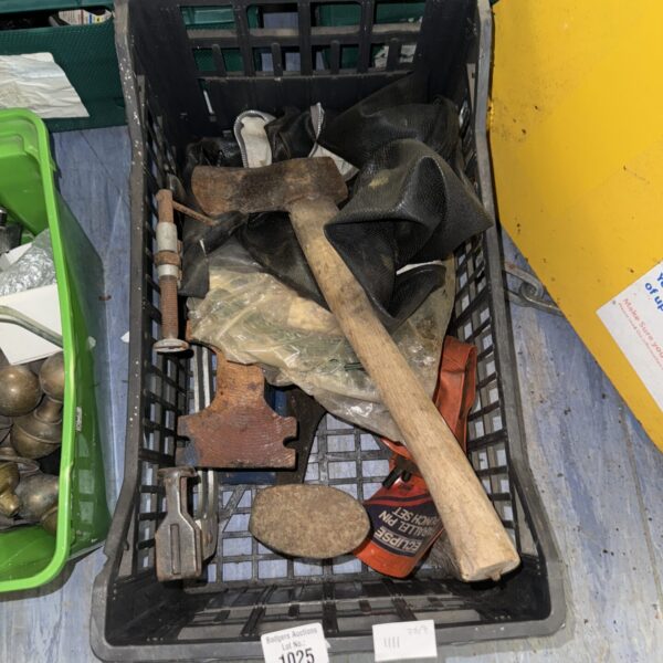 Assorted vintage hand tools in a metal container.