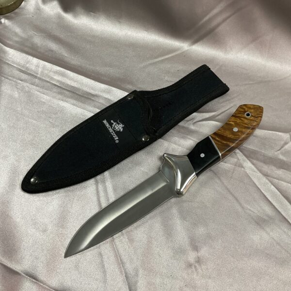 Winchester sheath knife with wood handle and black nylon sheath.