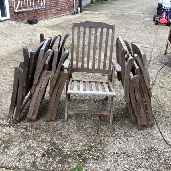 Lot of six weathered teak folding garden chairs.