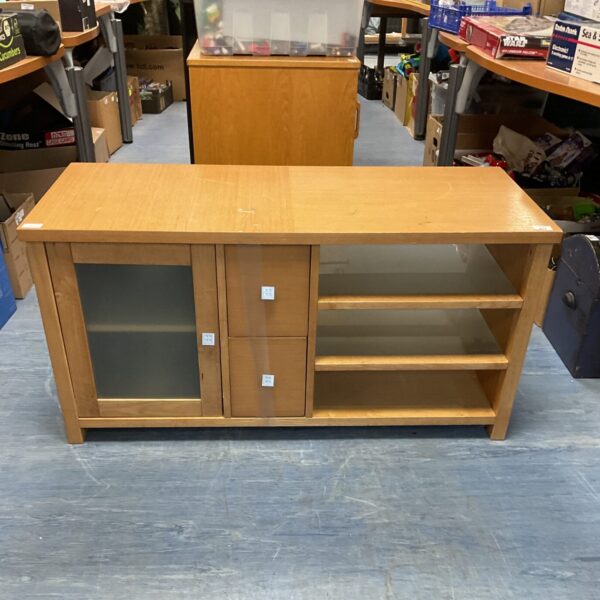 Front view of a classic oak media cabinet with glass doors.
