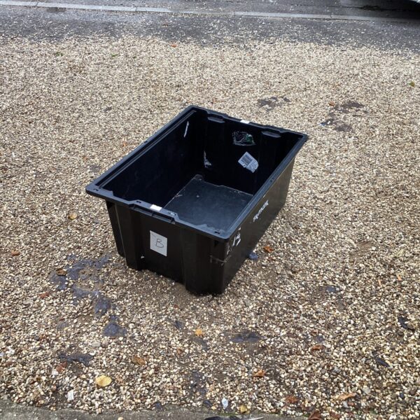Large plastic storage box for organisation and storage.