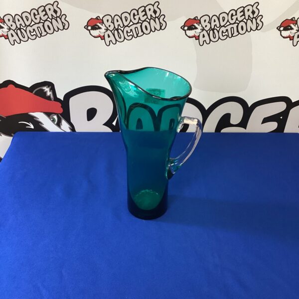 Vibrant green vintage Murano glass pitcher for collectors.