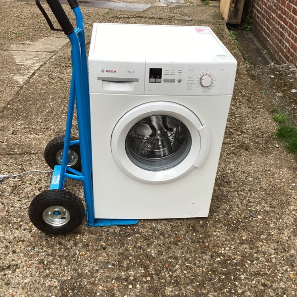 White Bosch Maxx 6 washing machine on a trolley.