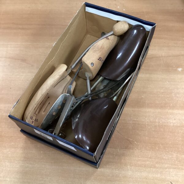 Vintage collection of wooden shoe lasts for shoemaking.