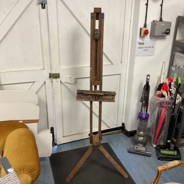 Large vintage wooden easel for artists and painting displays.