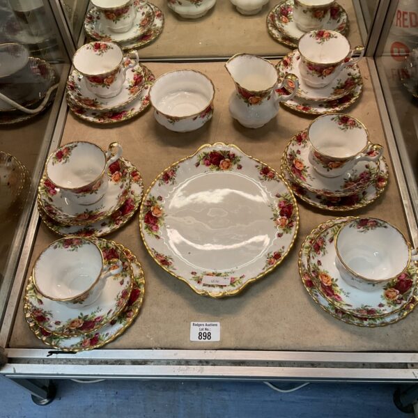 Vintage Royal Albert bone china tea service set with floral design.
