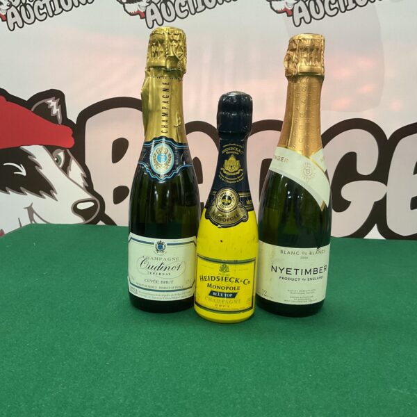 Lot of three miniature champagne and wine bottles for collectors.