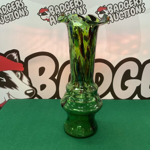 Vibrant Murano style vase with green and amber swirls.