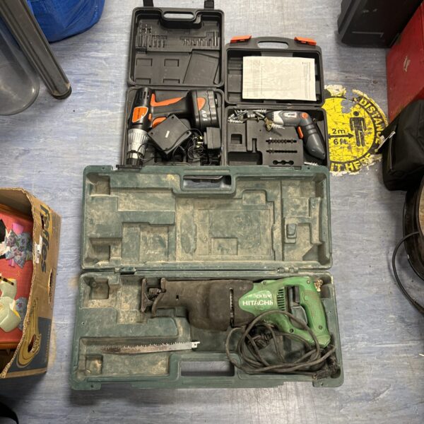 Power tool lot including a Hitachi reciprocating saw and cordless drills.