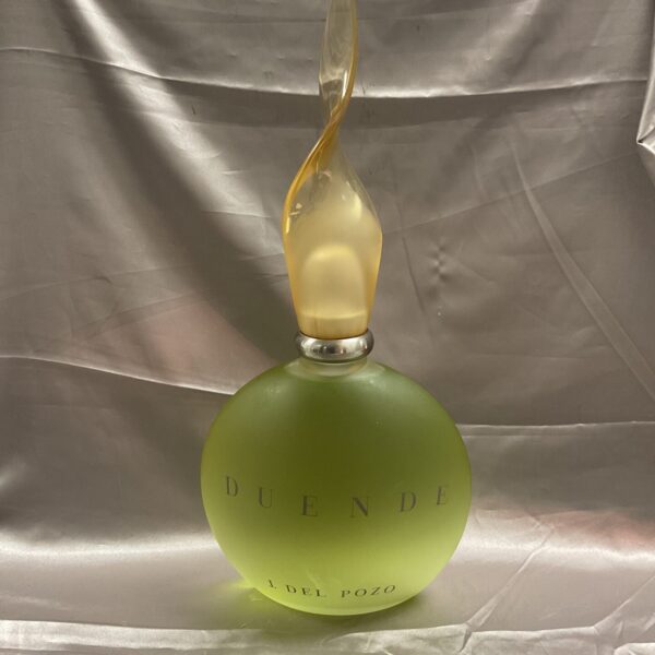 Vintage Duende Del Pozo Zeus perfume bottle in amber glass.