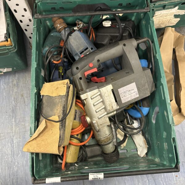 Assorted power tools in a plastic storage tray for DIY projects.