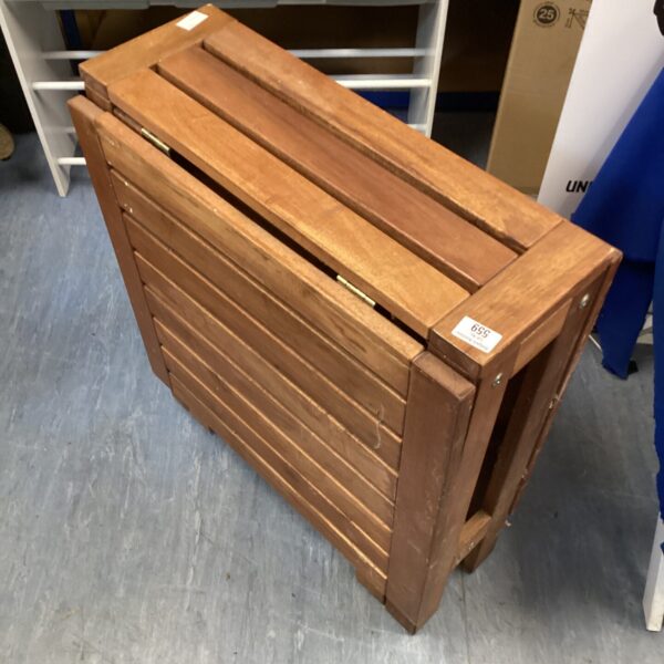 Wooden folding garden table with drop leaf, ideal for outdoor use.