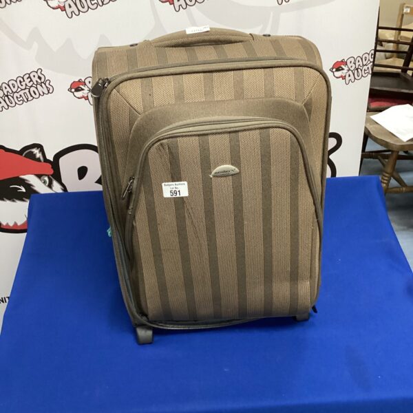 Vintage brown Members London suitcase for travel and collection.