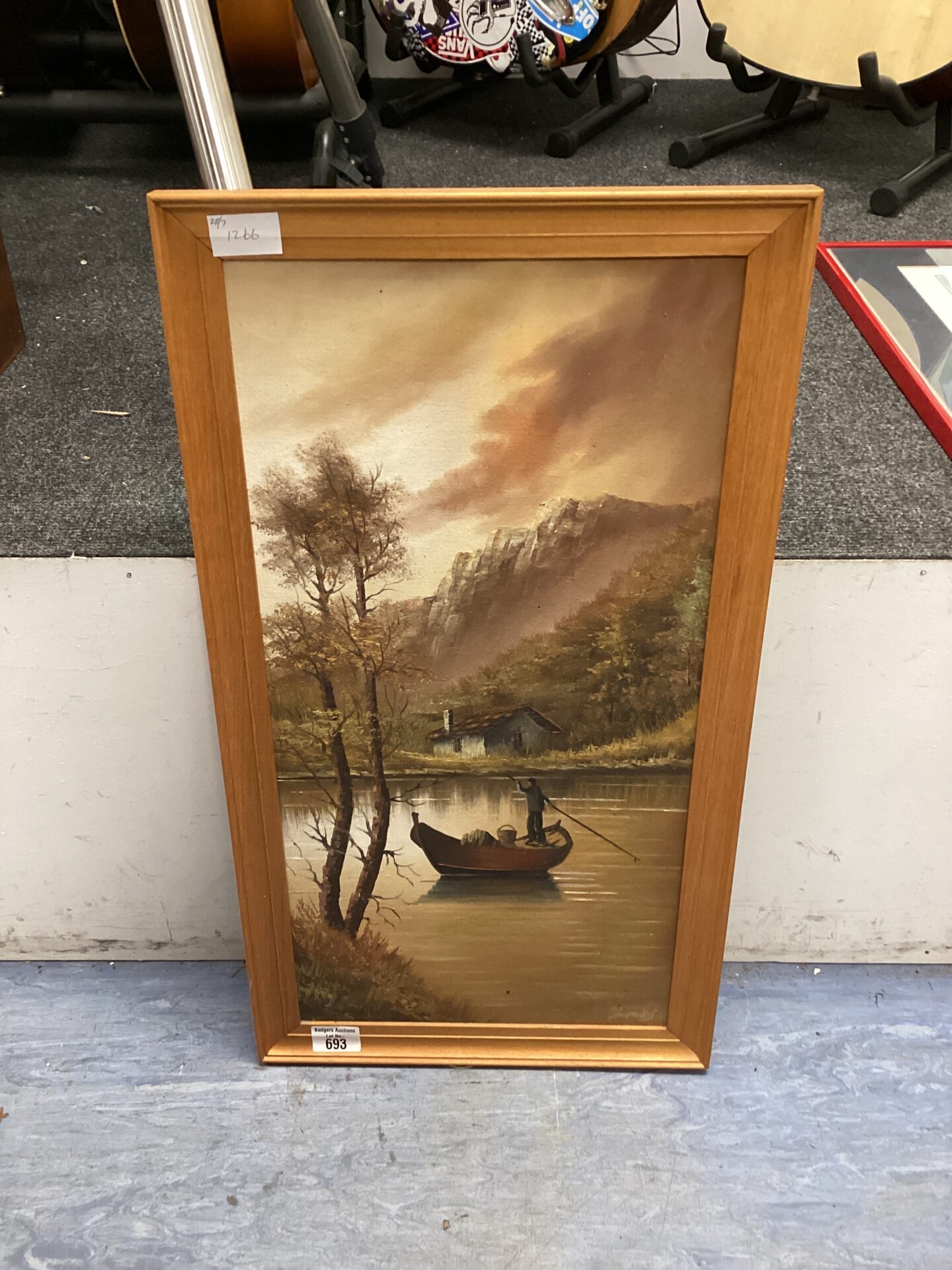 693 Framed oil on board of man on the lake